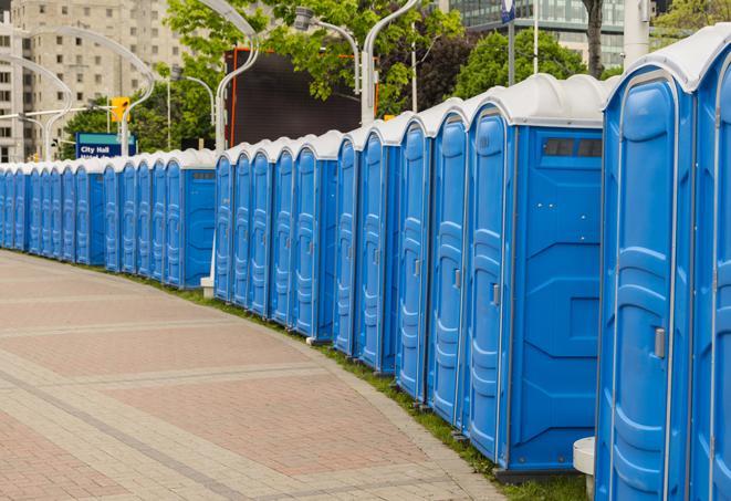 a row of portable restrooms set up for a large athletic event, allowing participants and spectators to easily take care of their needs in Cornwall, PA